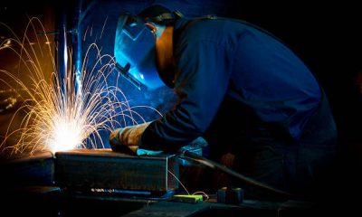 A welder fabricating structural steel